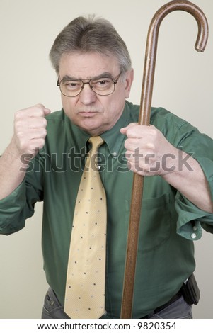 stock-photo-angry-man-with-cane-9820354.jpg