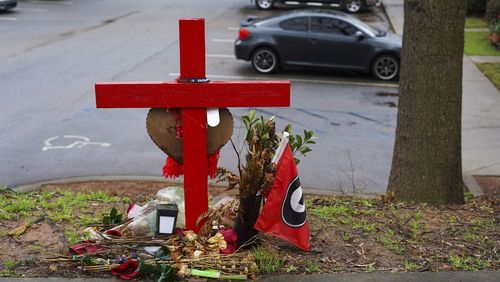 A memorial honoring the site of the car crash that ended the lives of Georgia offensive lineman, Devin Willock, 20, and UGA recruiting analyst, Chandler LeCroy, 24, sits at the intersection of Barnett Shoals and Stroud roads, east of downtown Athens, Georgia, on Thursday, March 2, 2023. (Olivia Bowdoin / AJC). 