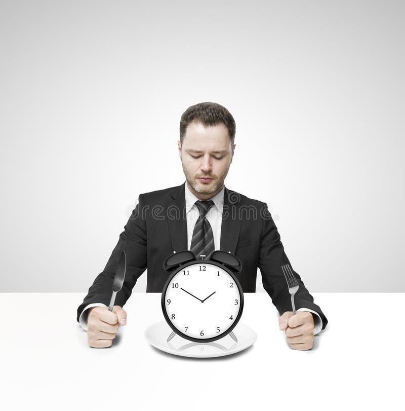 businessman-eating-clock-sitting-table-31428910.jpg