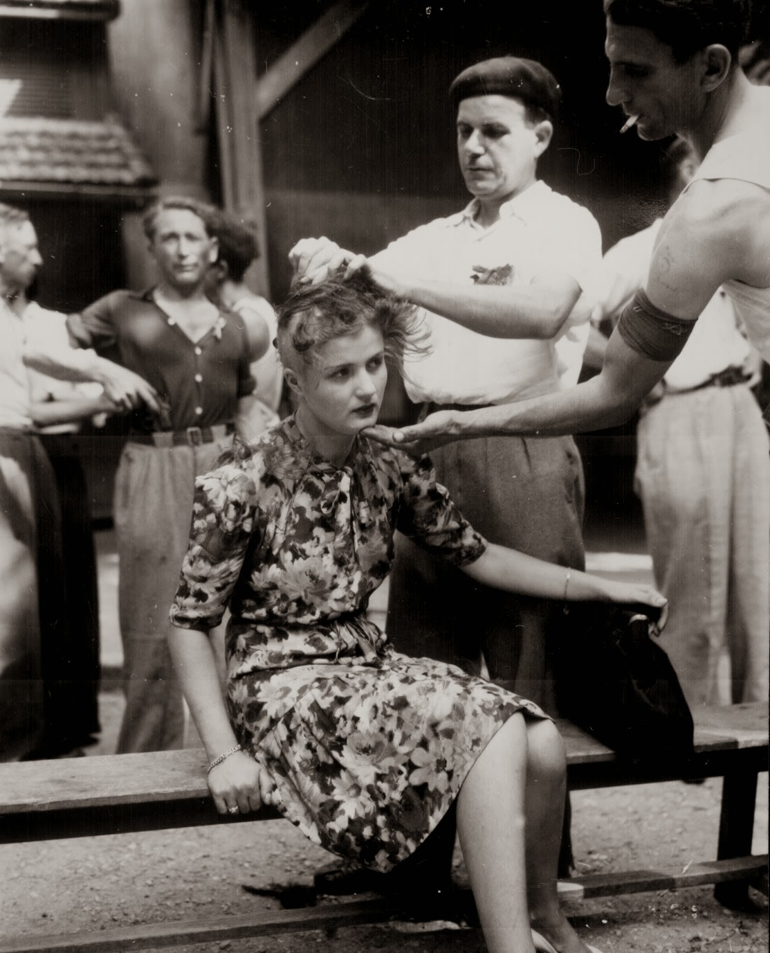 A+French+woman+has+her+head+shaved+by+civilians+as+a+penalty+for+having+consorted+with+German+troops,+1944.jpg