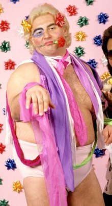 220px-Adrian_Adonis_with_rose.jpg