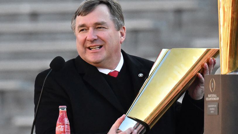 Georgia's head coach Kirby Smart holds the National Championship trophy during the celebration of the Bulldogs going back-to-back to win the 2022 National Championship at Sanford Stadium, Saturday, Jan. 14, 2023, in Athens. (Hyosub Shin / Hyosub.Shin@ajc.com)'s head coach Kirby Smart holds the National Championship trophy during the celebration of the Bulldogs going back-to-back to win the 2022 National Championship at Sanford Stadium, Saturday, Jan. 14, 2023, in Athens. (Hyosub Shin / Hyosub.Shin@ajc.com)